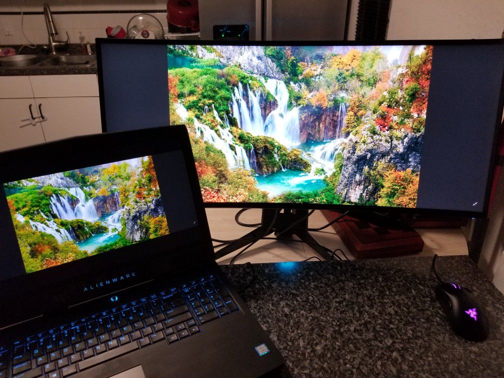 OBO gaming Alienware laptop and huge curved monitor