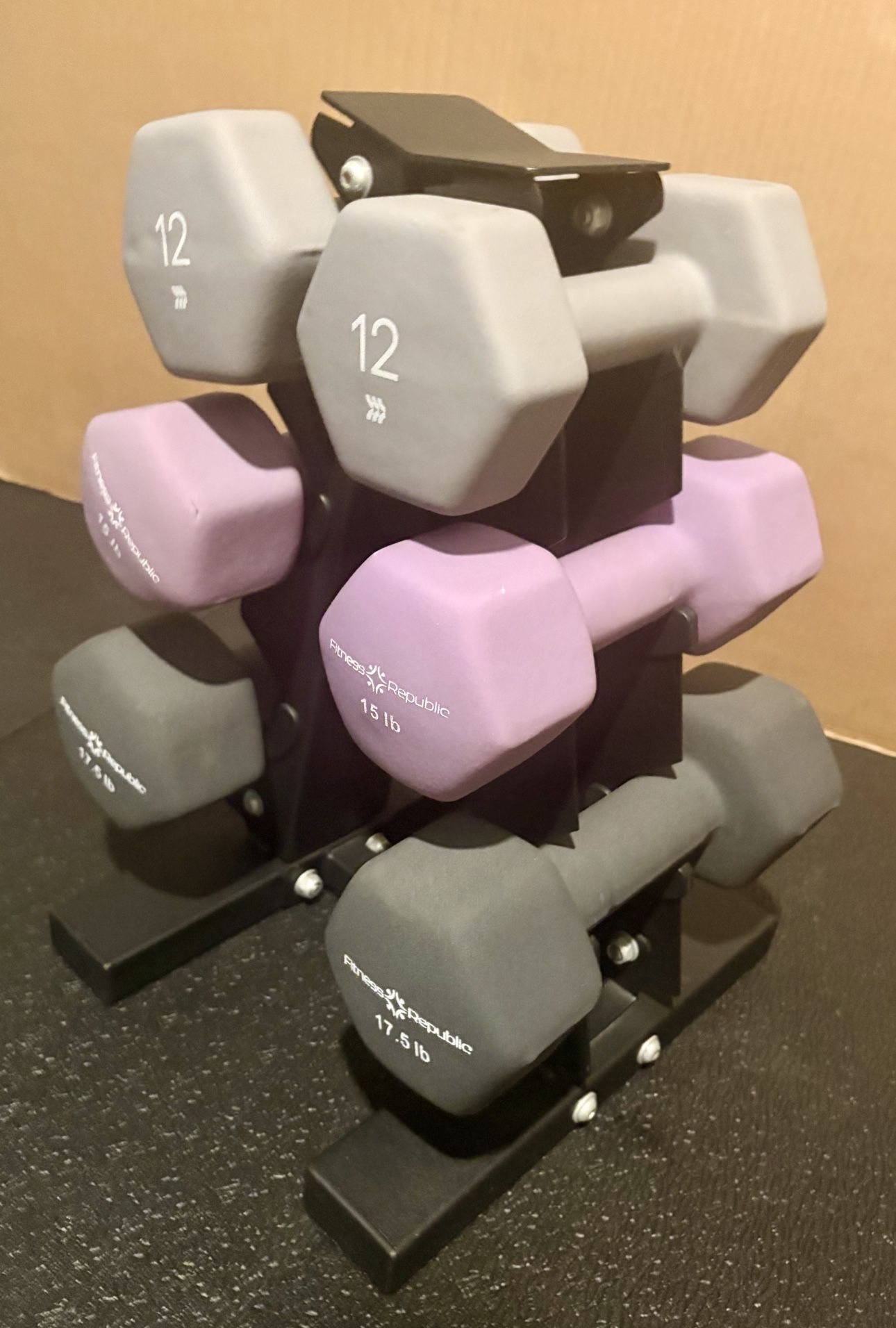Cast Iron Neoprene Coat ...Set of Dumbbells with Rack; pairs of  12s, 15s and 17.5 lbs.