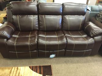New leather reclining sofa with drop-down table