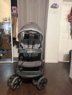 Foldable double seated stroller with storage under and sun covers