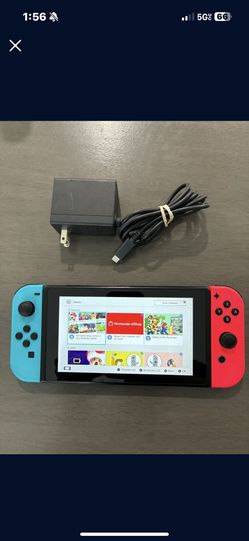 Nintendo Switch System / Console - Red Blue Version - Works Good - Includes Charger. System has some scratches but works good. Only comes with home ch