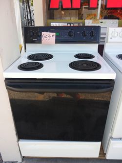 Kenmore coil top stove range oven white. Warranty . Delivery available . 2203 Fowler st. Ft. Myers 33901 1stop best appliances.