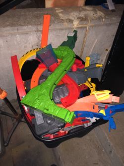 Two big storage containers of hot wheels tracks