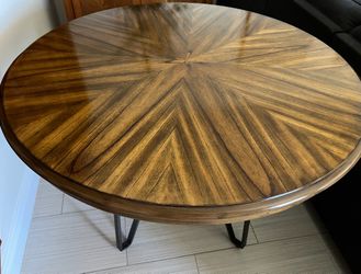 Solid wood dining table with metal legs