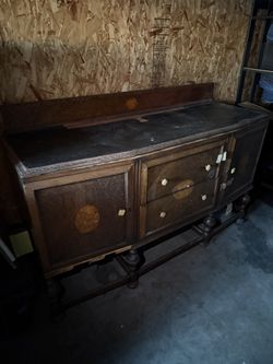 wooden buffet or sideboard, likely in a Victorian or Jacobean style