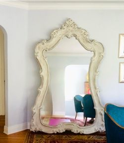 Stunning floor mirror French scroll decor in antique white. Over 7’ tall
