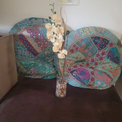 Fake Orchids In Clear Vase With Rocks