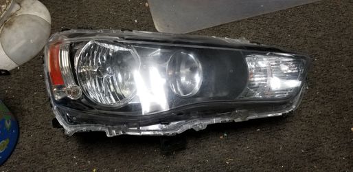 10 11 12 13 2010 2011 2012 2013 Mitsubishi Outlander right passenger side headlight