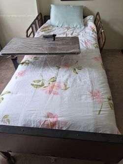 Hospital bed with accesories. Great conditition with remote for adjusting,  new over bed table . Comfoter, pillow and comfortable mattess.  Perfect fo