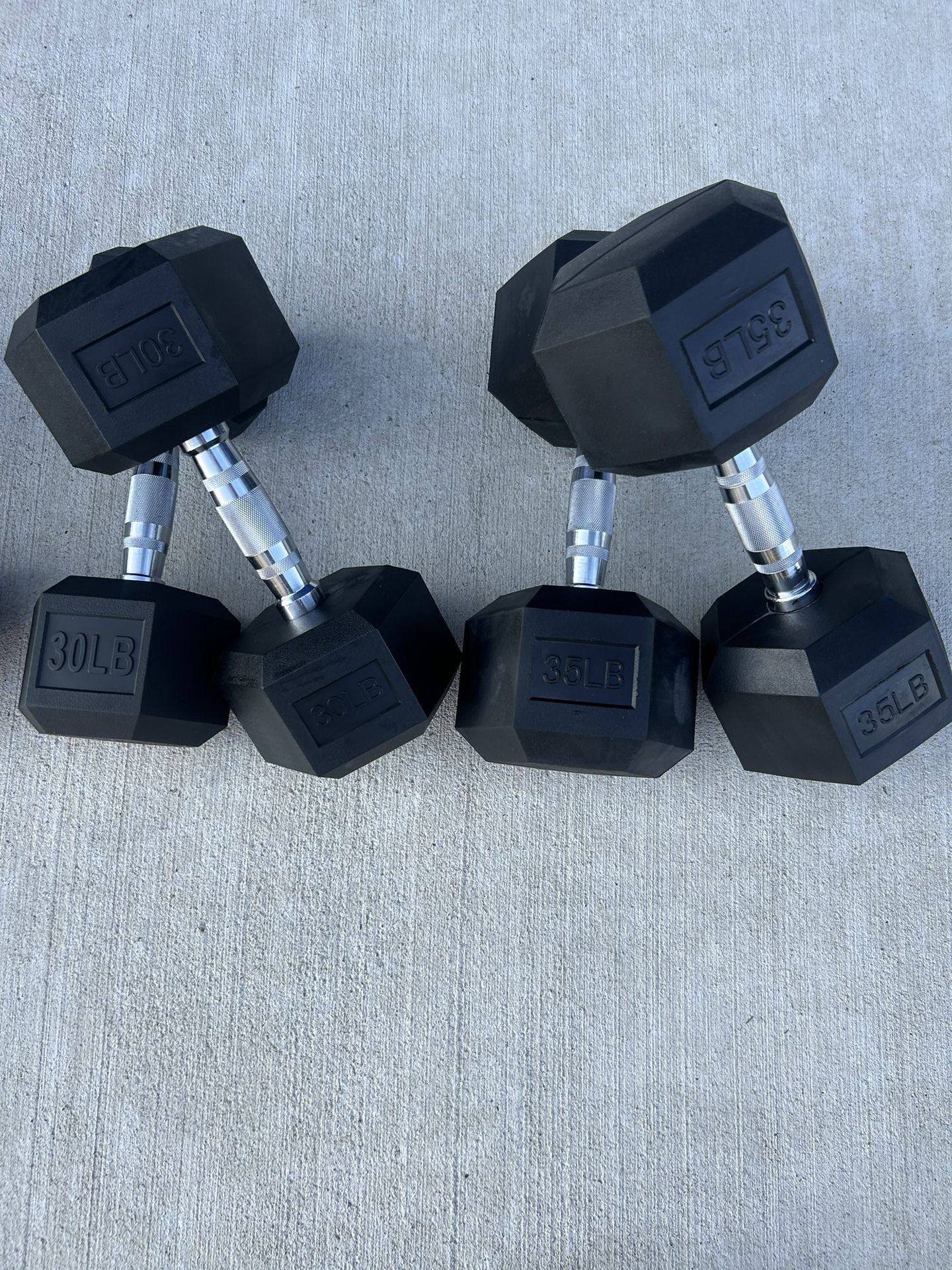 new  pair of 30lb and 35lb rubber dumbbells  $130