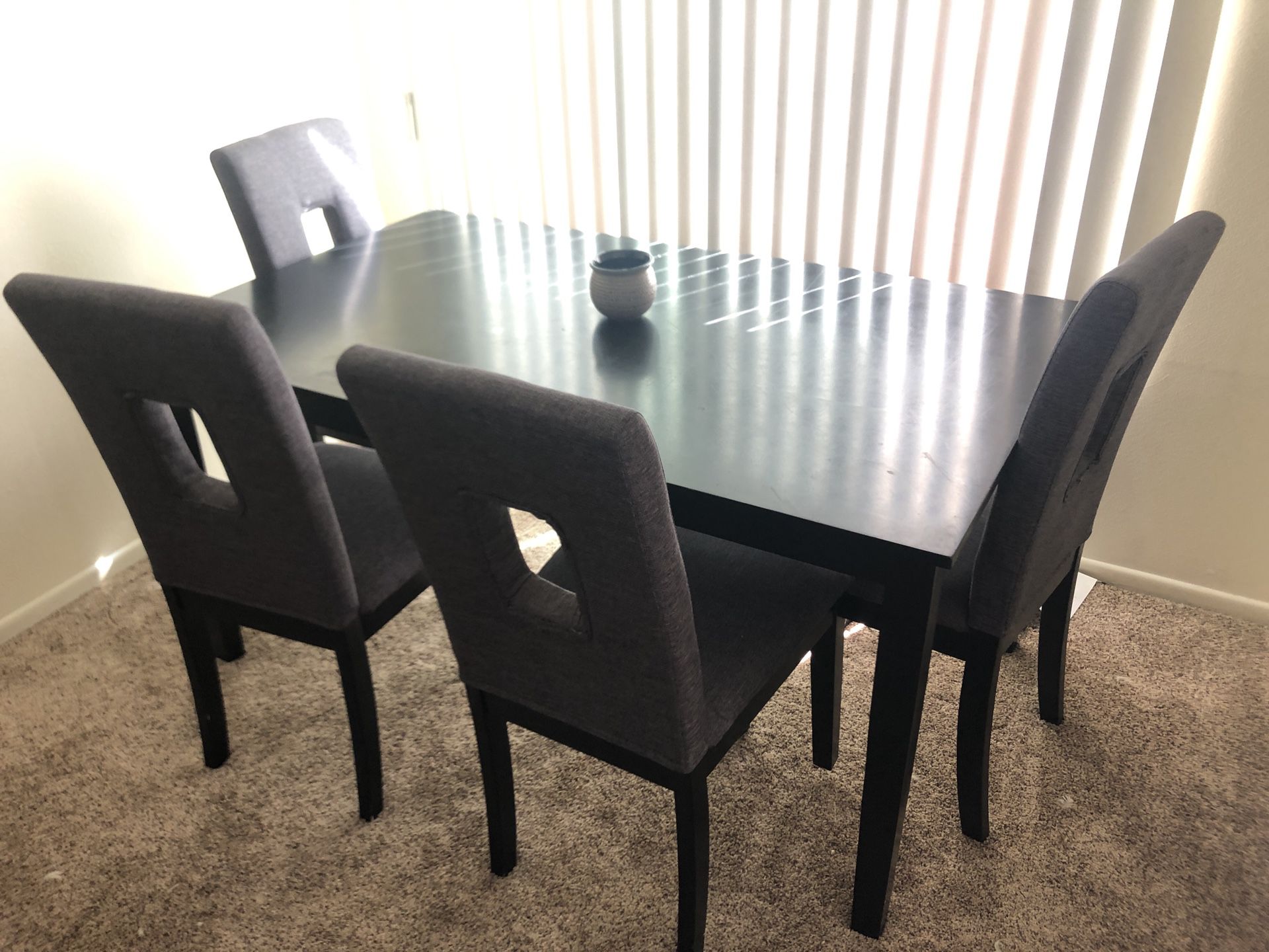 Black kitchen table with grey and black chairs