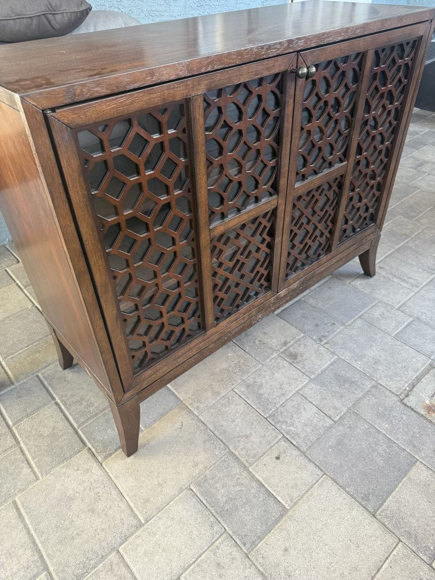 Elegant Wood Cabinet with Decorative Lattice Doors