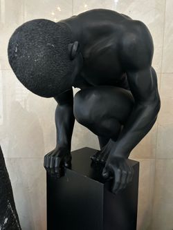 Black Crouching Man Sculpture