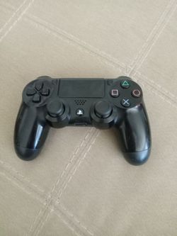 Sony PlayStation 4 DualShock 4 Wireless Controller in Jet Black.