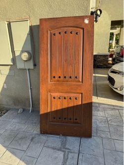 Mastergrain Fiberglass Entry Door with Cherry Grain and Clavos