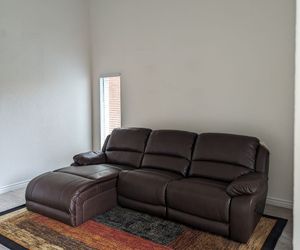 Like-New Leather Reclining Sectional Sofa with Chaise