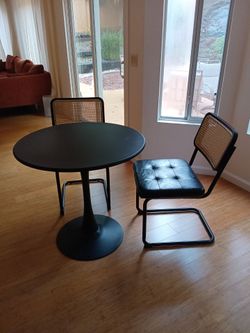 Round Black Dining Table with 2 Cane Back Chairs