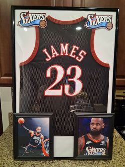 LEBRON JAMES OF THE PHILADELPHIA 76ERS, CUSTOM STITCHED, BRANDED, AUTHENTIC FRAMED JERSEY.