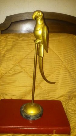 Vintage brass parrot on perch