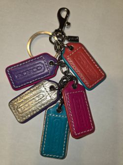 Coach vintage heritage bag charm keychain, featuring five colorful leather hangtags