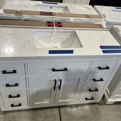 48” Bathroom Vanity in white , single sink soft close solid wood with vanity top in white  $799  Luke’s liquidations warehouse Address:  2434 N Forsyt