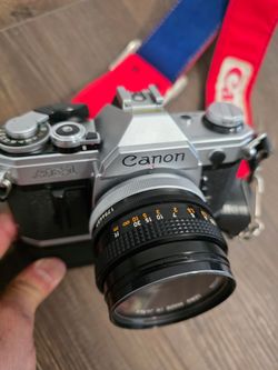 Vintage 35mm Film Camera Canon AE-1 W/ Canon 50mm Lens and Soligor 85-205mm Lens, Case, Winder, Flash, (2) Film Rolls & Instruction Guide SEE DESCRIPT