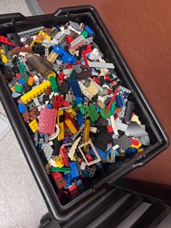 Box full of Legos small pieces