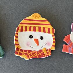 Set of three decorative holiday winter snowman themed plates 