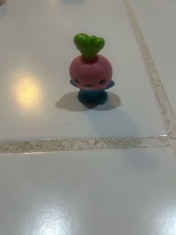 the Codish Fisher-Price action figure from the animated series The Octonauts (released around 2013), depicting a pink and blue radish-like Vegimal cha