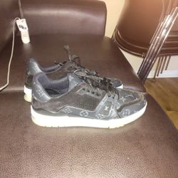 Louis Vuitton Trainer sneaker in black monogram-embossed patent calf leather