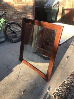Brown wooden framed mirror