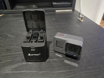GoPro Hero 6 with 64 GB micro SD card, 3 additional batteries, & charging case