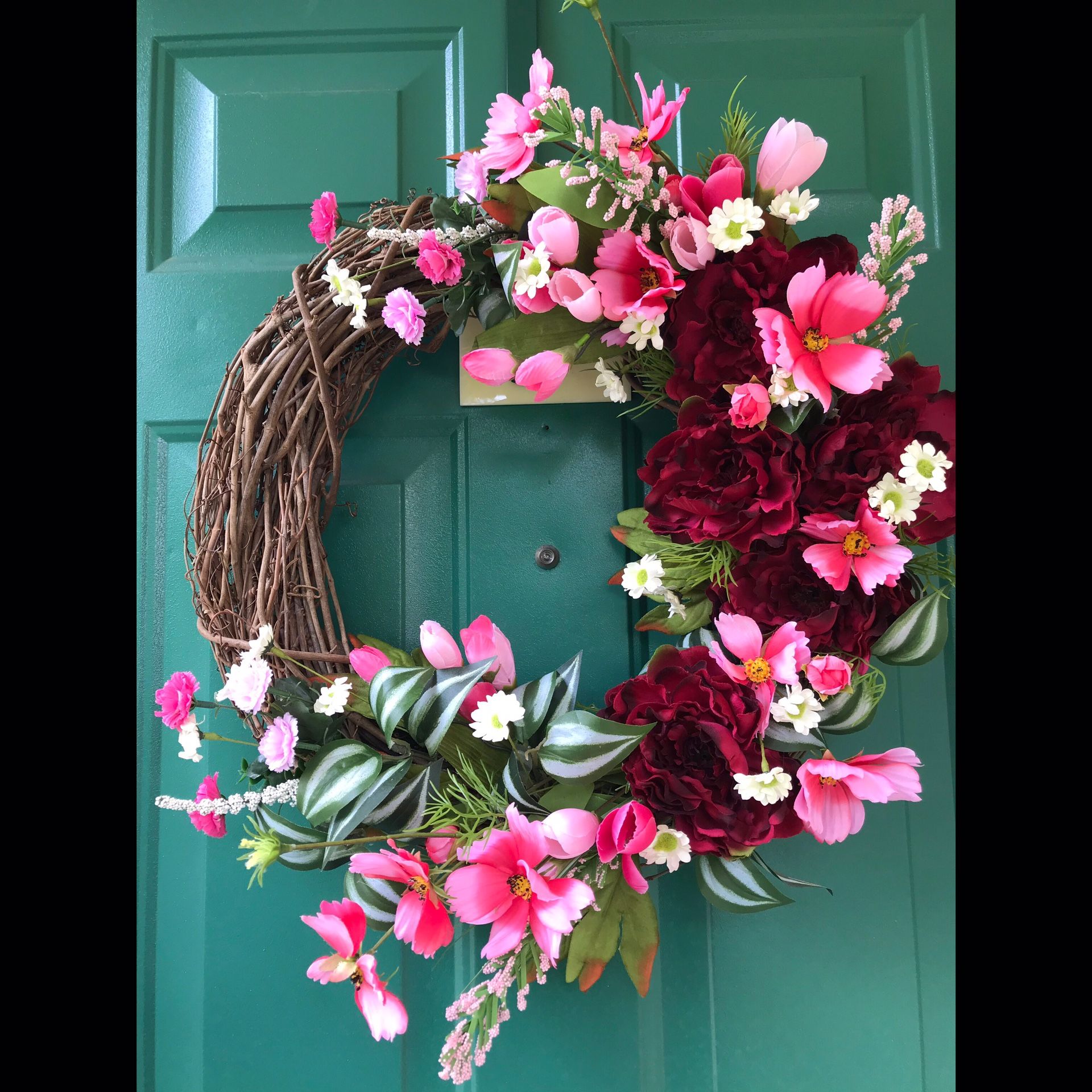 Pink floral grapevine wreath