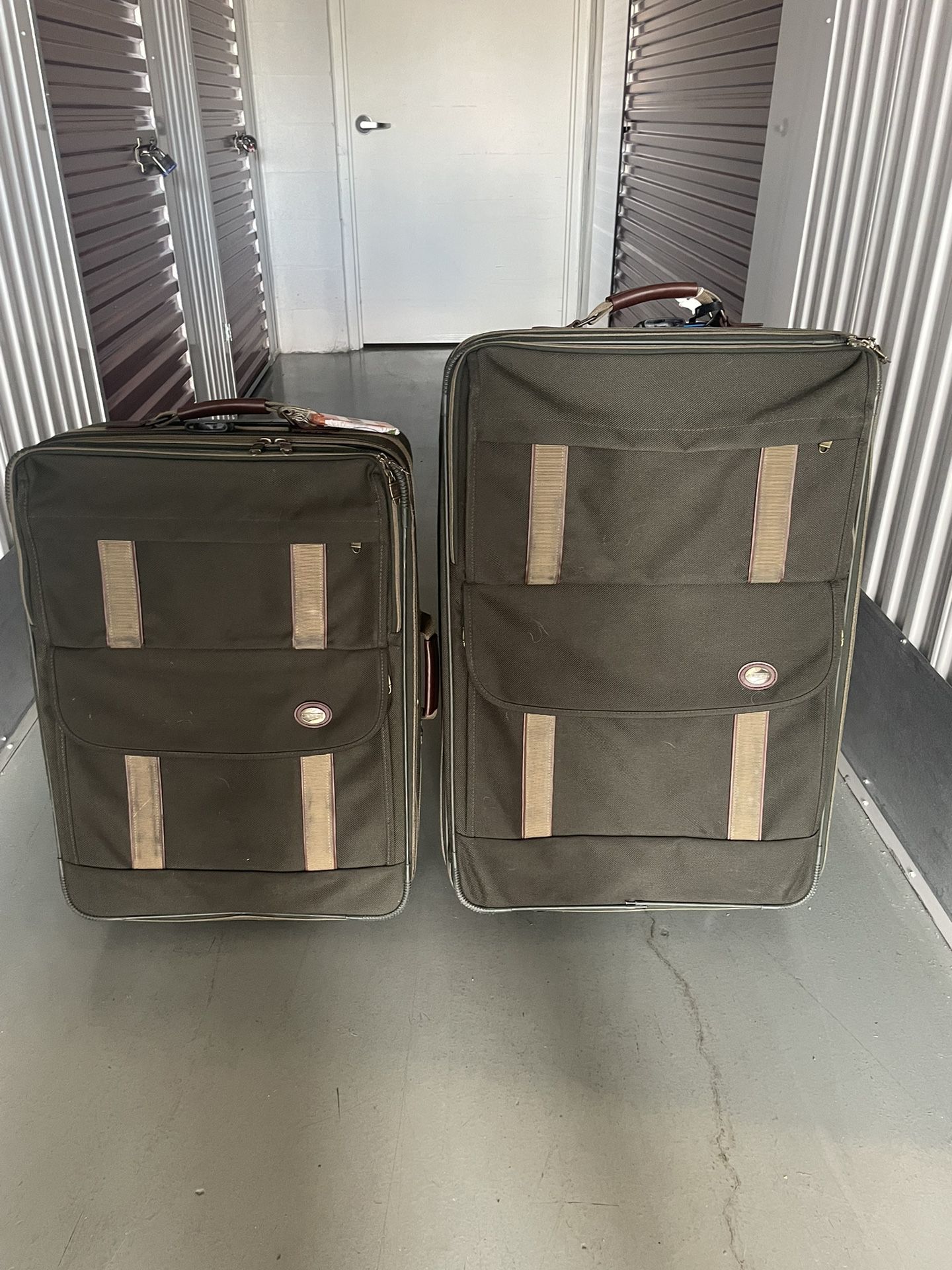 Two Green Suitcases With Wheels
