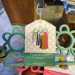 Two sets of two accessory hangers $5 ea
Two pink $5
Two teal $5