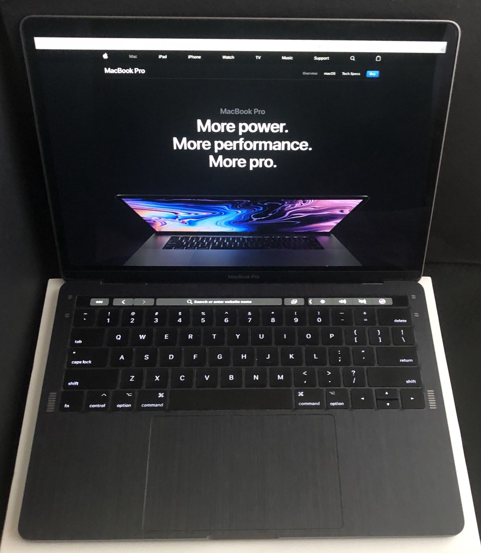 MacBook Pro 13 in with touch bar and dbrand black dragon skin