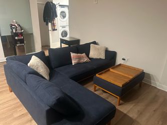 Large blue sectional & storage ottoman
