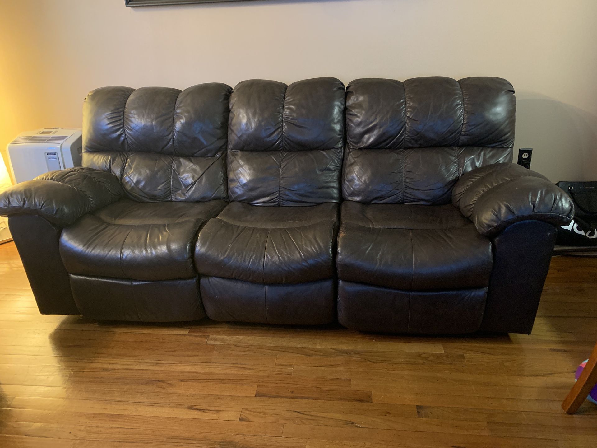 Brown leather sofa with 4 recliners!!!