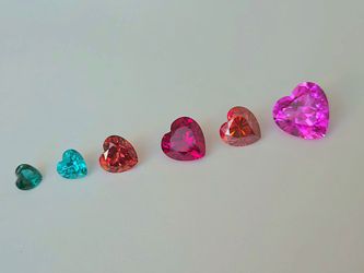 Various heart shape faceted previous Gemstones in different colors and sizes. Authentic Lab Grown Ruby, Sapphire, Emerald, Moissanite, and more! MESSA
