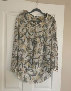 Blouse With A Floral Pattern 