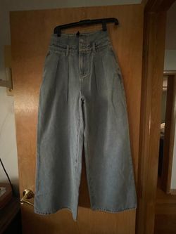 Jeans high waisted and wide leg .