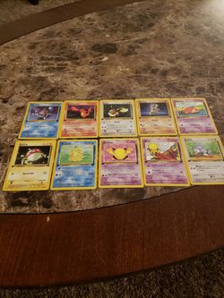 Pokemon 1st edition team rocket non holo cards, squirtle, charmander, eevee, machop, slowpoke