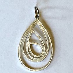 💧 Funky, silver tone concentric tear drop shapes pendant