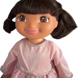 doll sings the "We Did It!" song and speaks bilingual phrases in English and Spanish.  It performs the signature "We Did It" dance, moving from side t