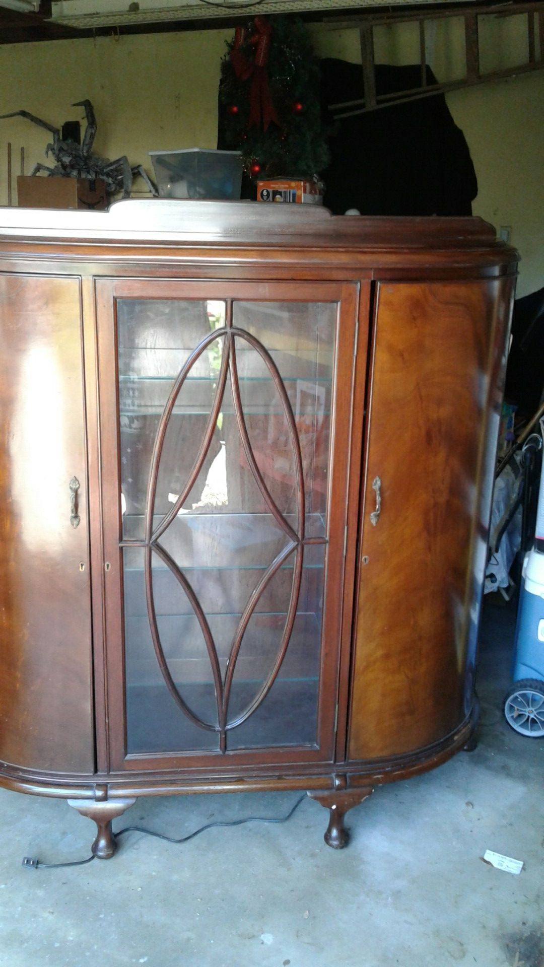 Beautiful antique lighted display or curio cabinet