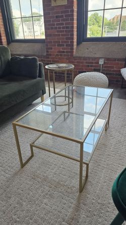 Gold rimmed glass coffee table and side table