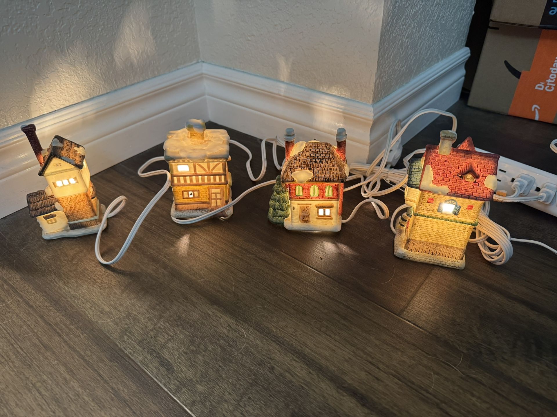 4 Vintage Lighted porcelain Houses