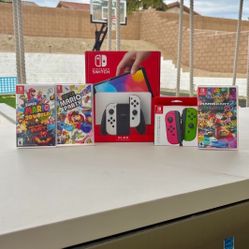 Nintendo switch Oled with extra controller and 3 Mario games Floor Model Display 
