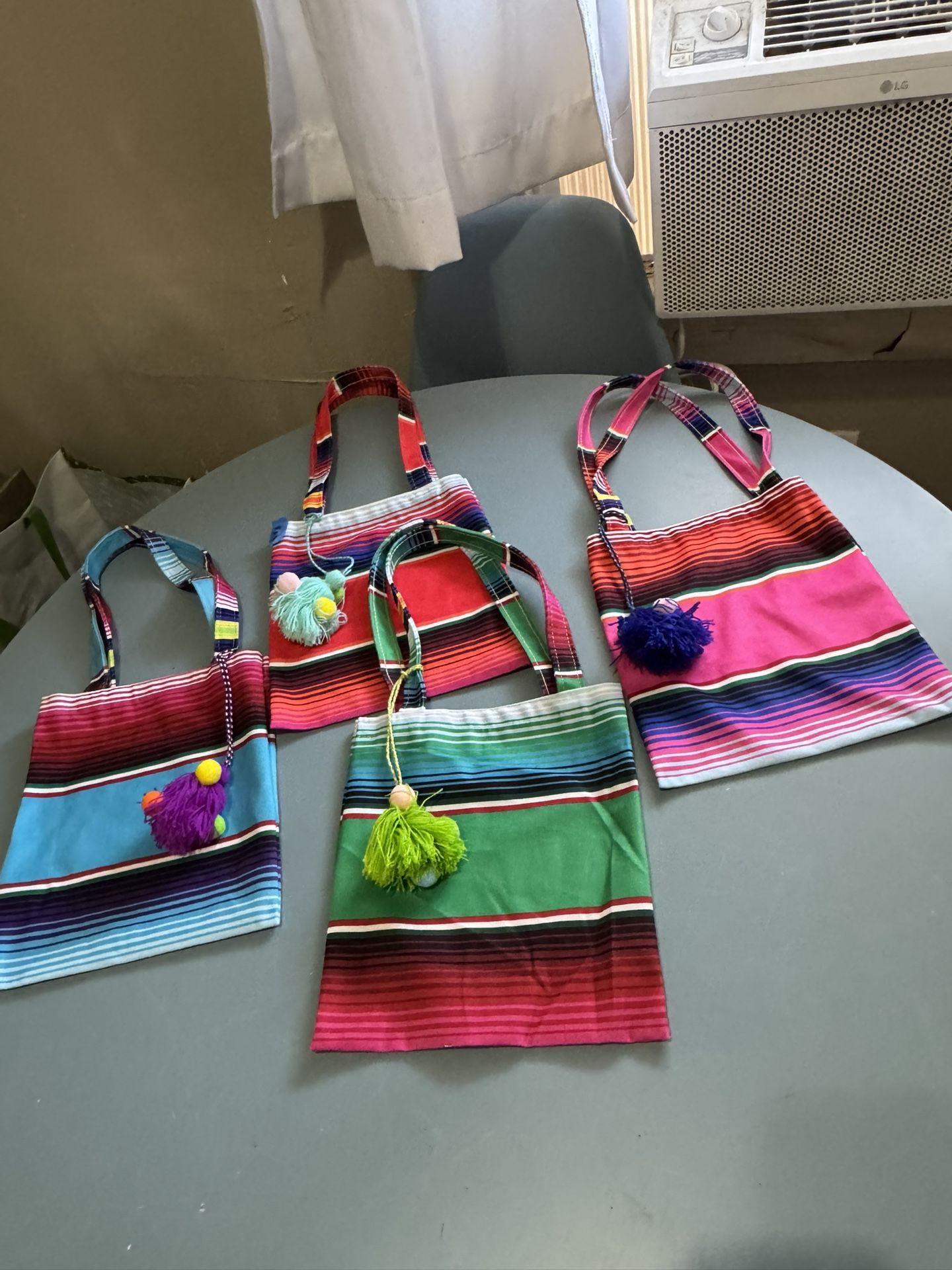 6 handwoven Mexican serape tote bags with colorful tassels