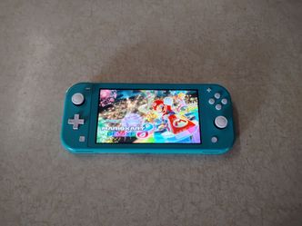 NINTENDO SWITCH LITE with 50 SWITCH GAMES